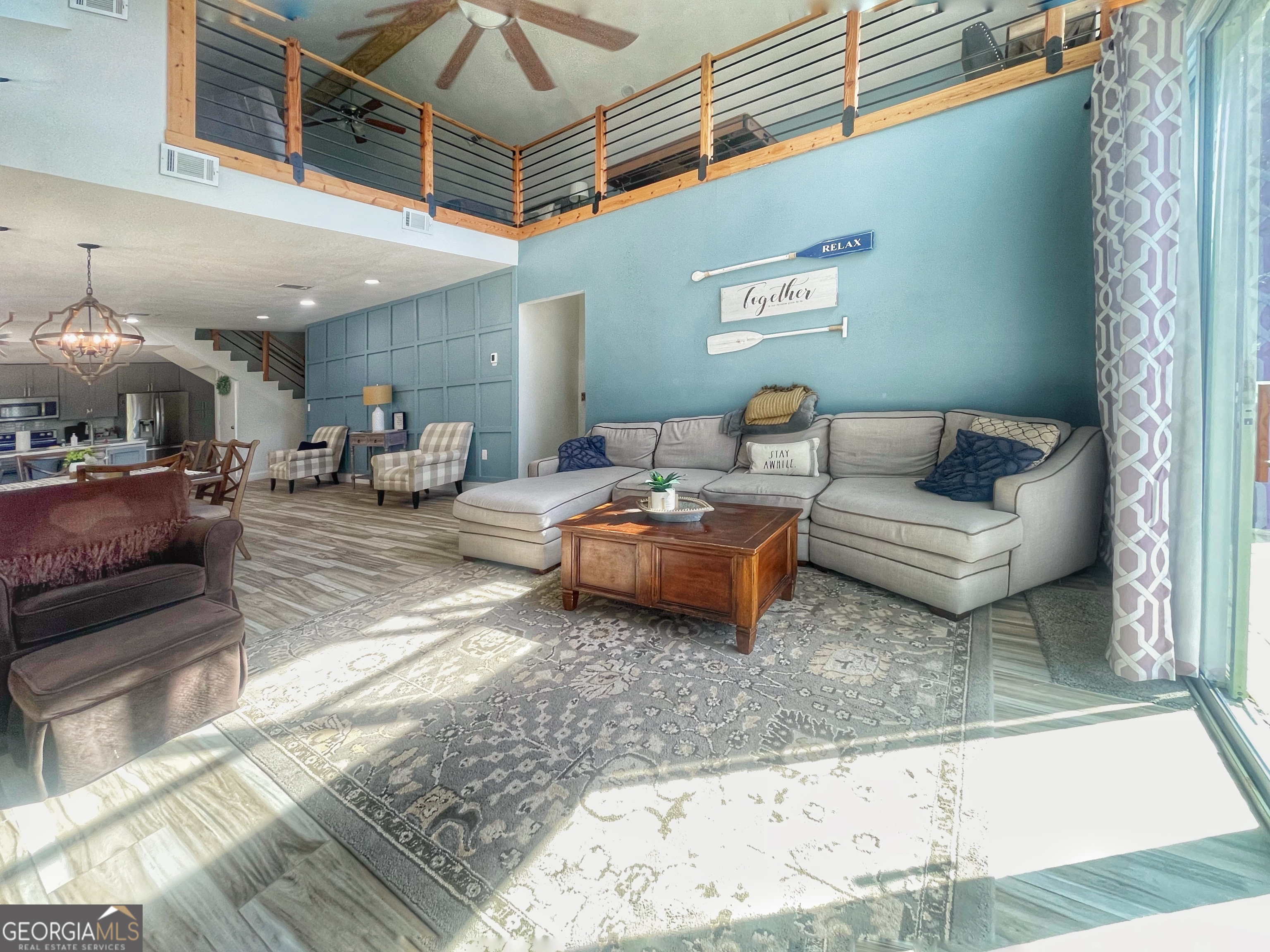 141 Edgewater Drive Eatonton, GA 31024 - Photo 21 of 85 a living room with furniture and a ceiling fan