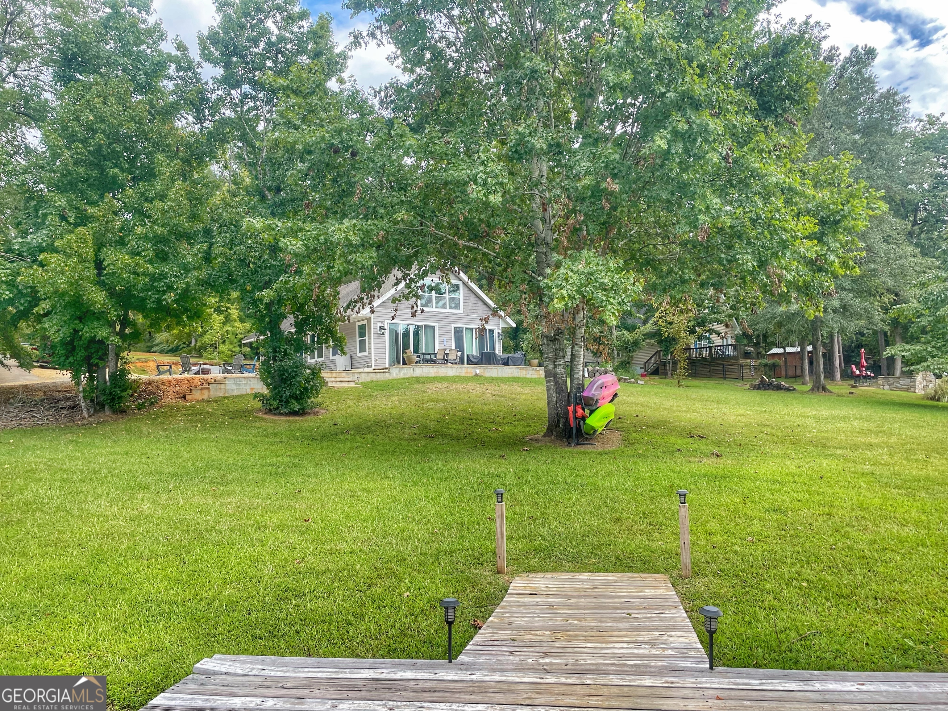141 Edgewater Drive Eatonton, GA 31024 - Photo 3 of 85 a view of a park with large trees