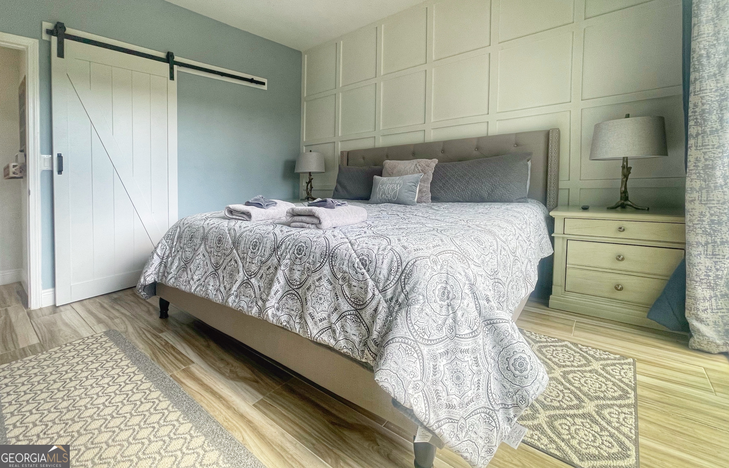 141 Edgewater Drive Eatonton, GA 31024 - Photo 33 of 85 a bedroom with a bed and a cabinets