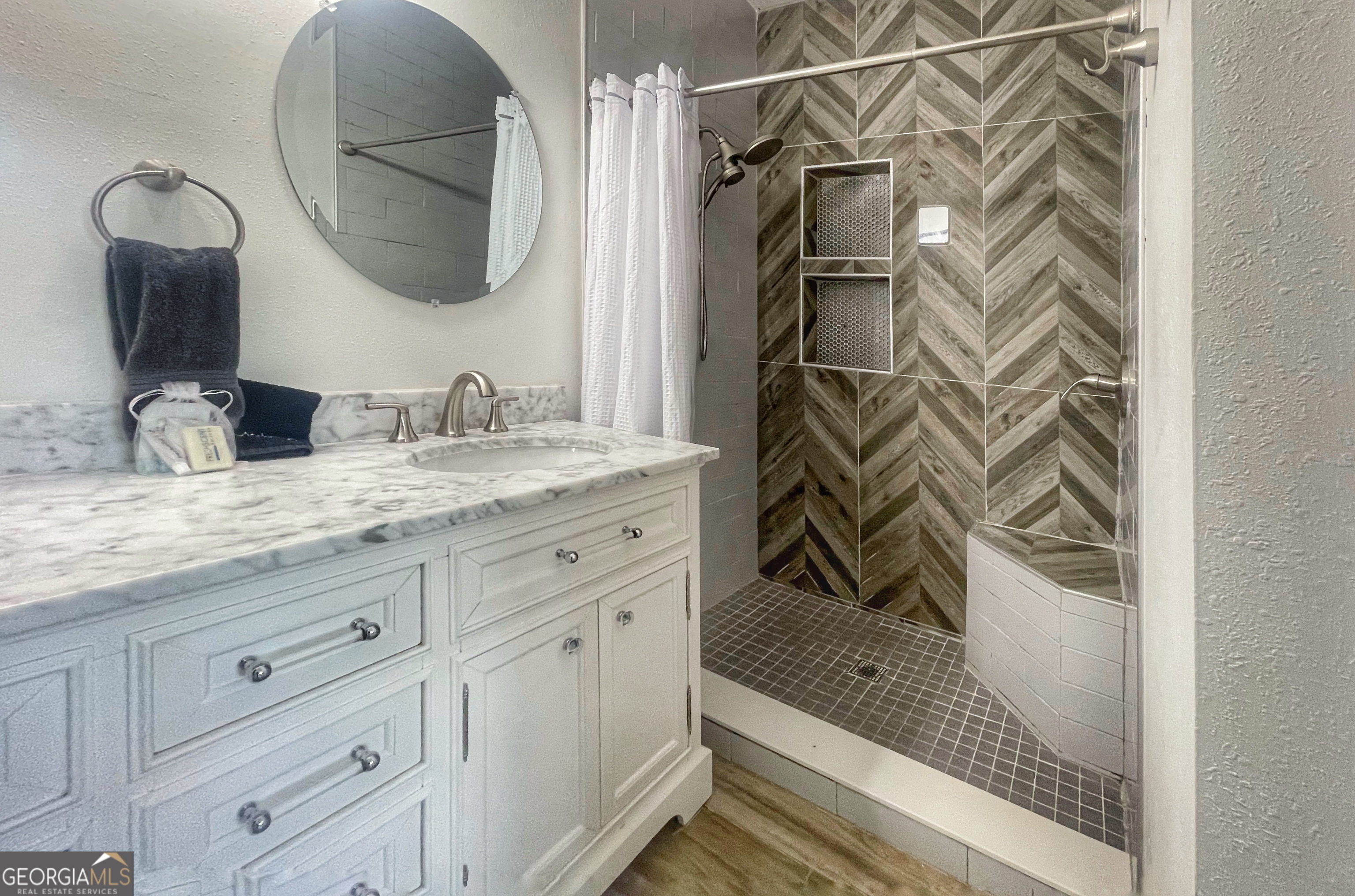 141 Edgewater Drive Eatonton, GA 31024 - Photo 39 of 85 a bathroom with a sink and a mirror