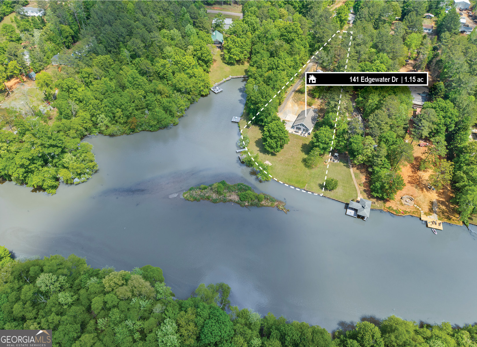 141 Edgewater Drive Eatonton, GA 31024 - Photo 4 of 85 an aerial view of a house with a yard and garden
