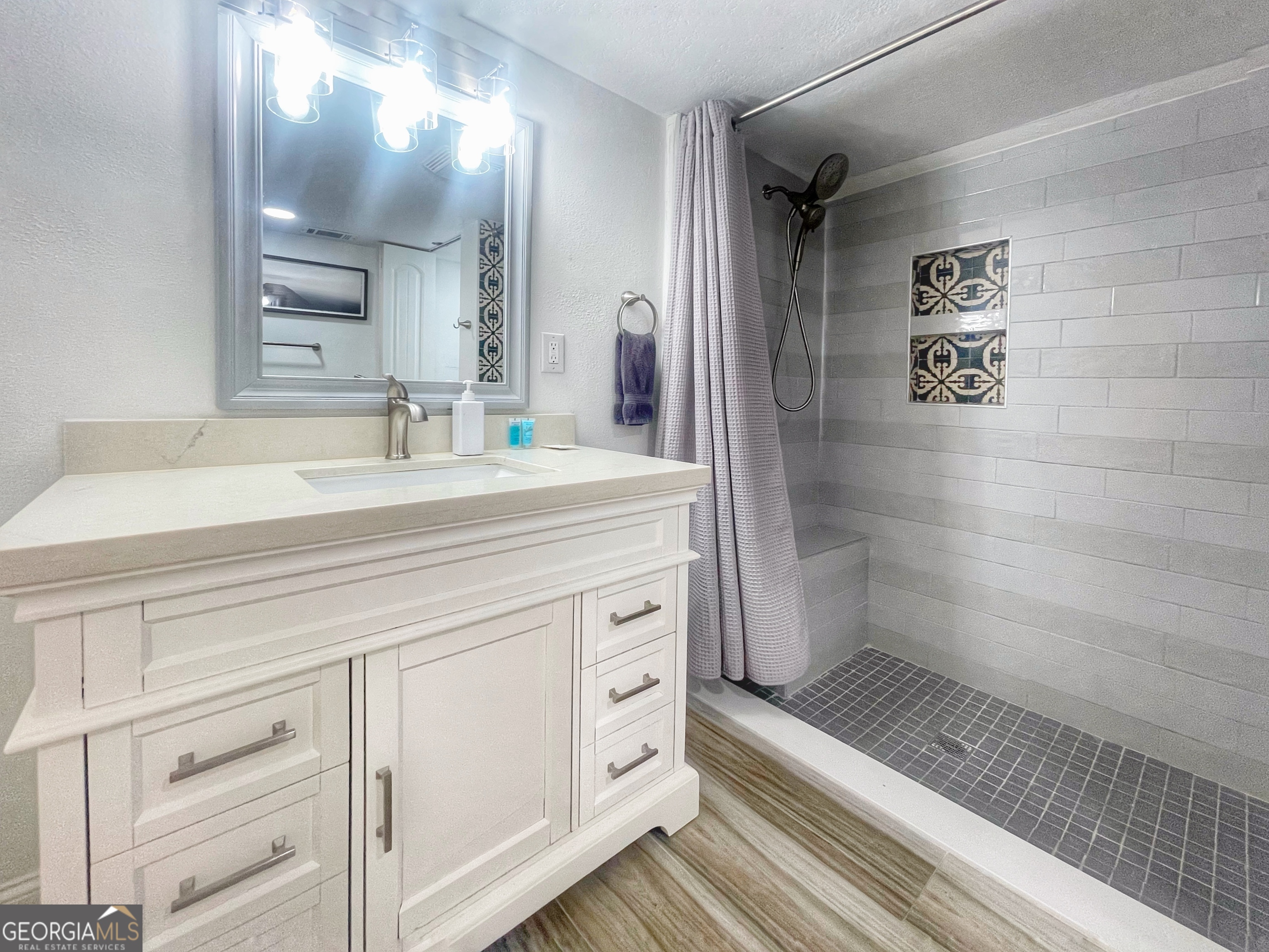 141 Edgewater Drive Eatonton, GA 31024 - Photo 55 of 85 a bathroom with a sink a toilet and shower