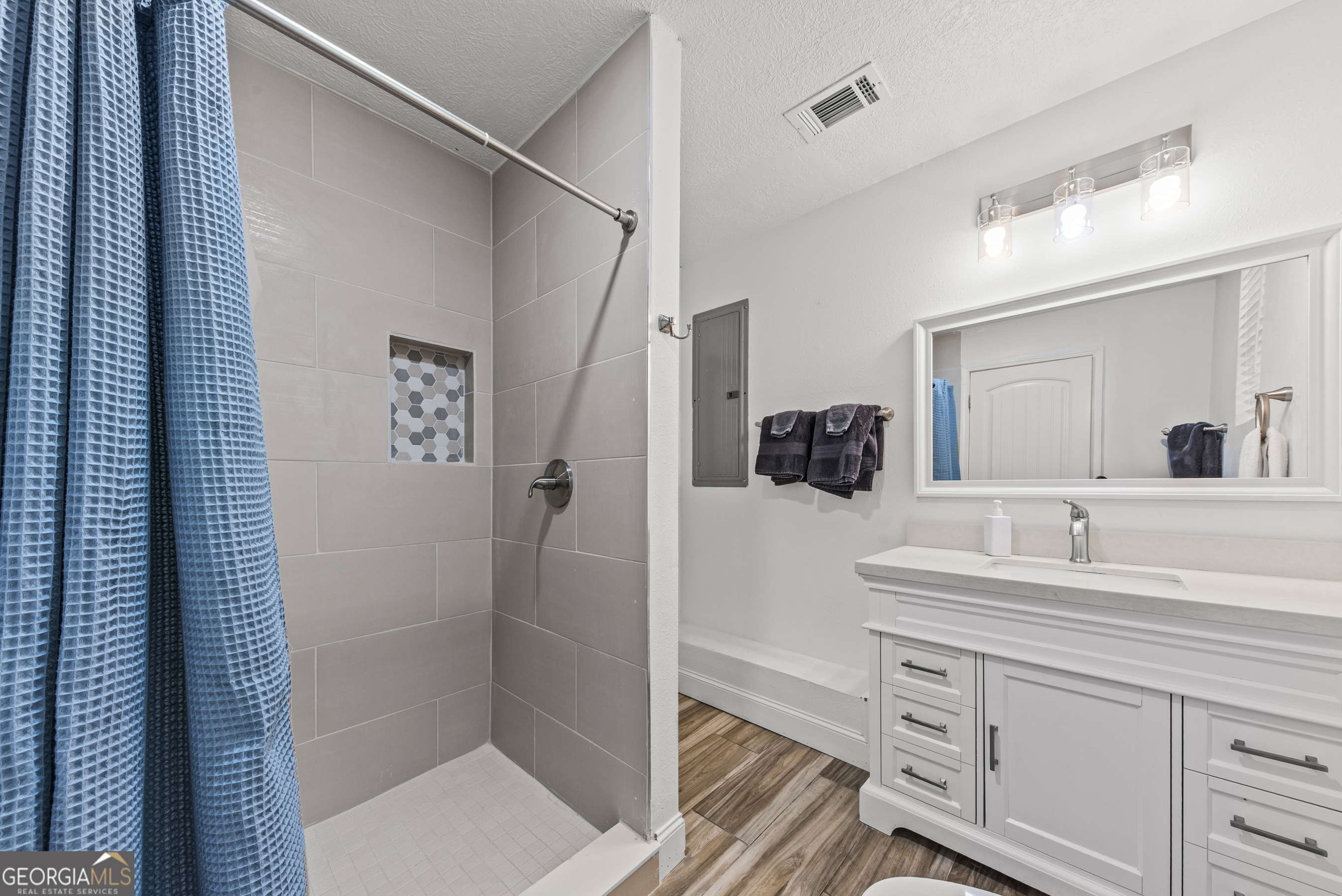 141 Edgewater Drive Eatonton, GA 31024 - Photo 66 of 85 a bathroom with a sink and a mirror