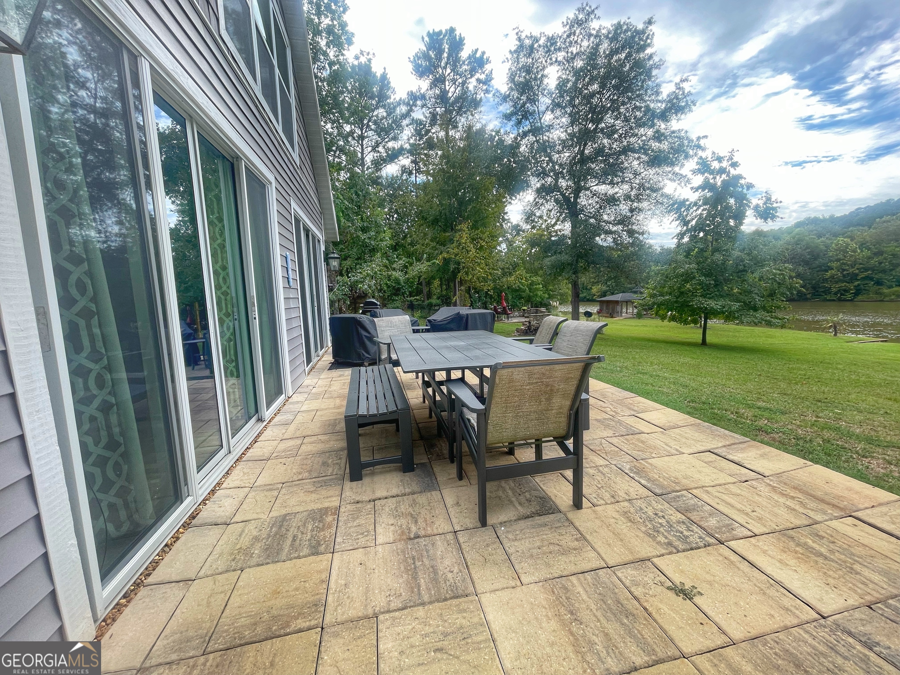 141 Edgewater Drive Eatonton, GA 31024 - Photo 69 of 85 a view of backyard with outdoor seating and green space
