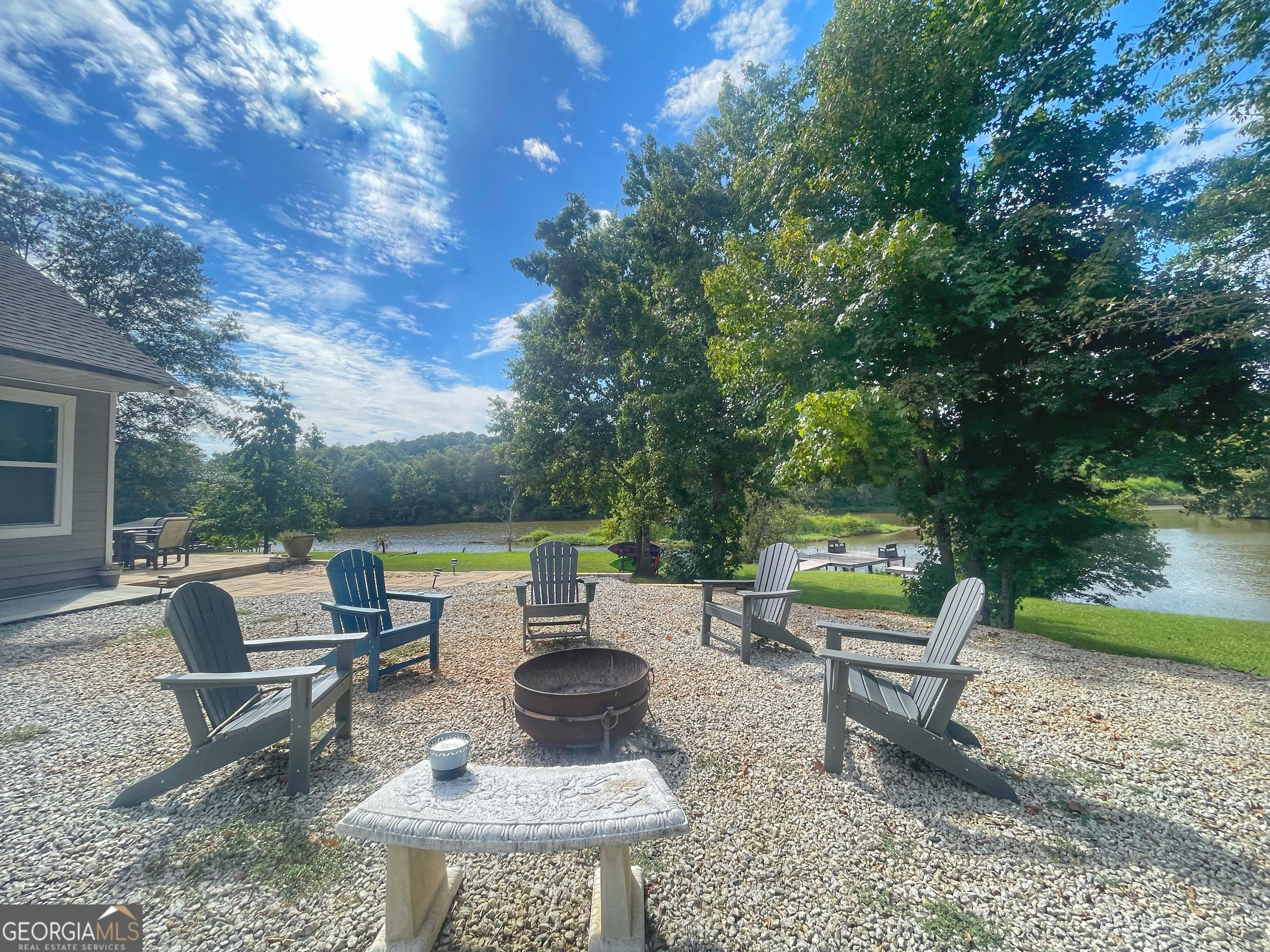 141 Edgewater Drive Eatonton, GA 31024 - Photo 7 of 85 a view of backyard with seating area and green space