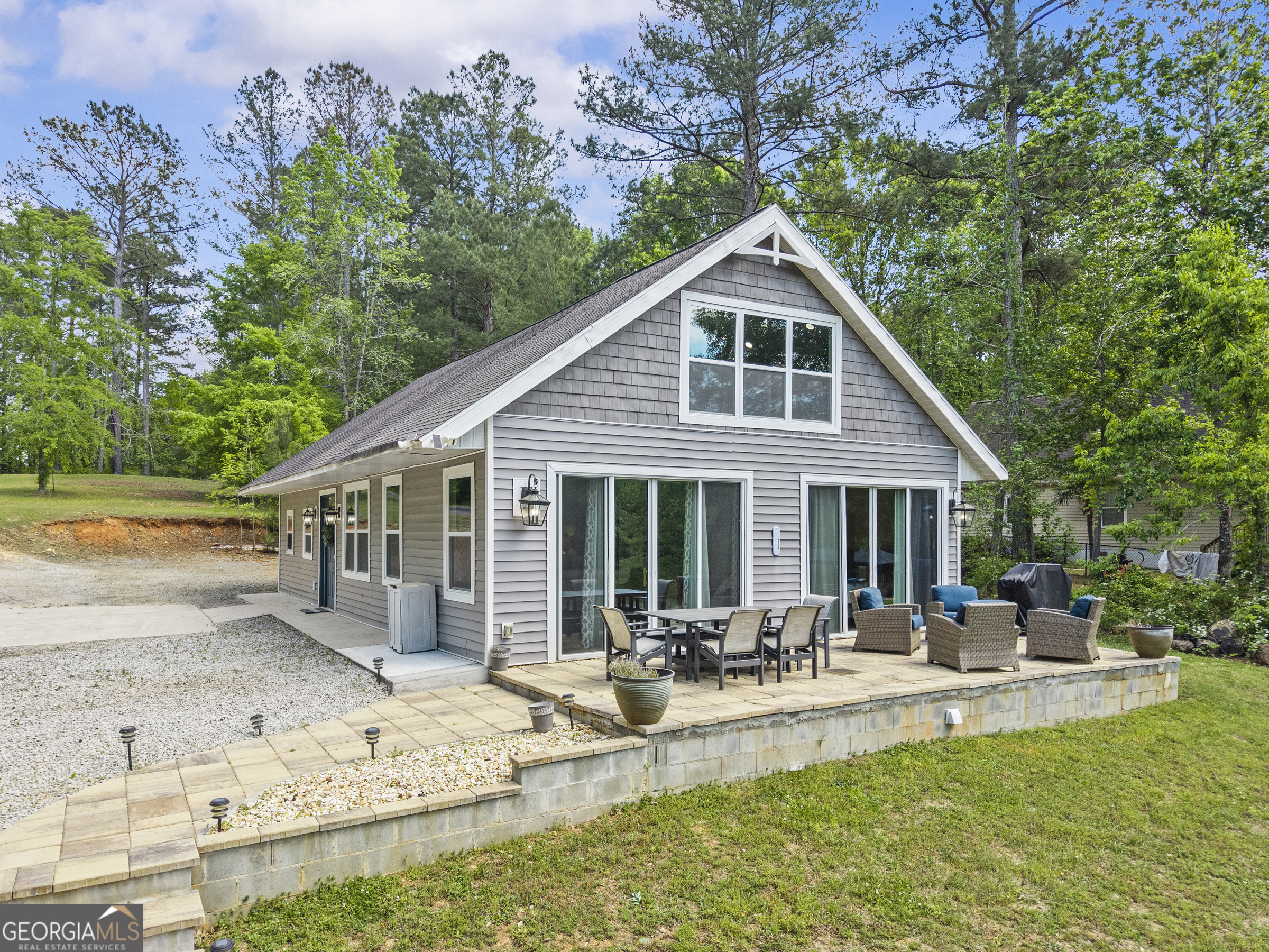 141 Edgewater Drive Eatonton, GA 31024 - Photo 8 of 85 a view of a house with a yard patio and swimming pool