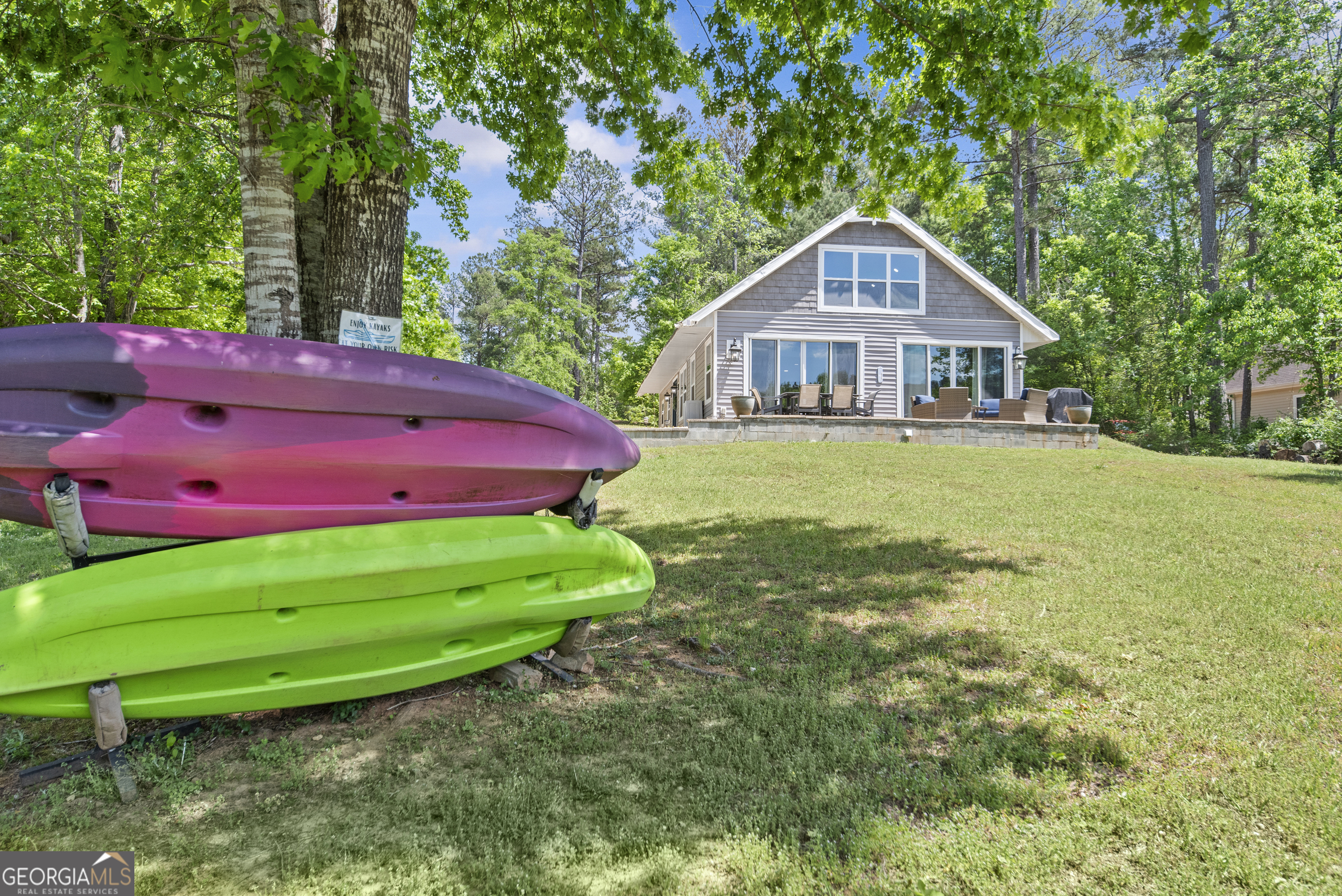 141 Edgewater Drive Eatonton, GA 31024 - Photo 81 of 85 a front view of a house with garden