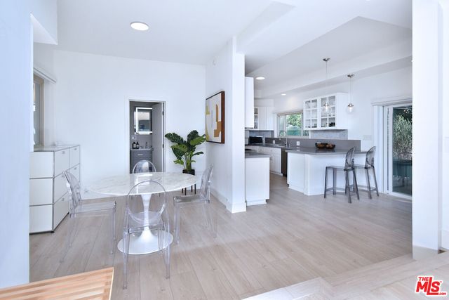 a view of kitchen and dining room with wooden floor