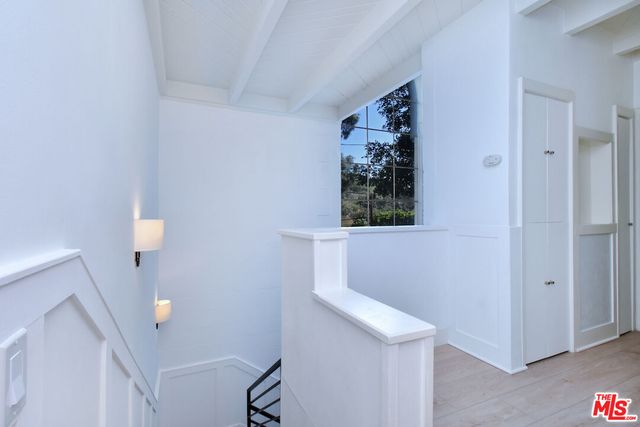 a view of entryway with stairs and wooden floor