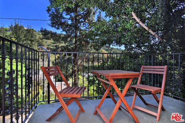 a patio with table and chairs