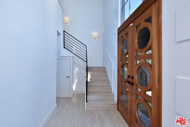 a view of a hallway with washer and dryer