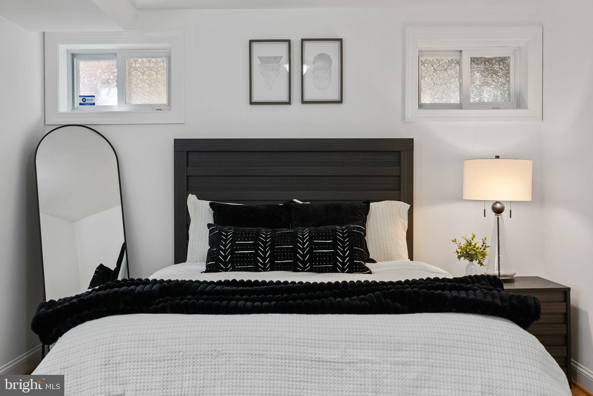 18 N Street Northwest, Unit 2 Washington, DC 20001 - Photo 12 of 24 a bedroom with bed and wooden floor
