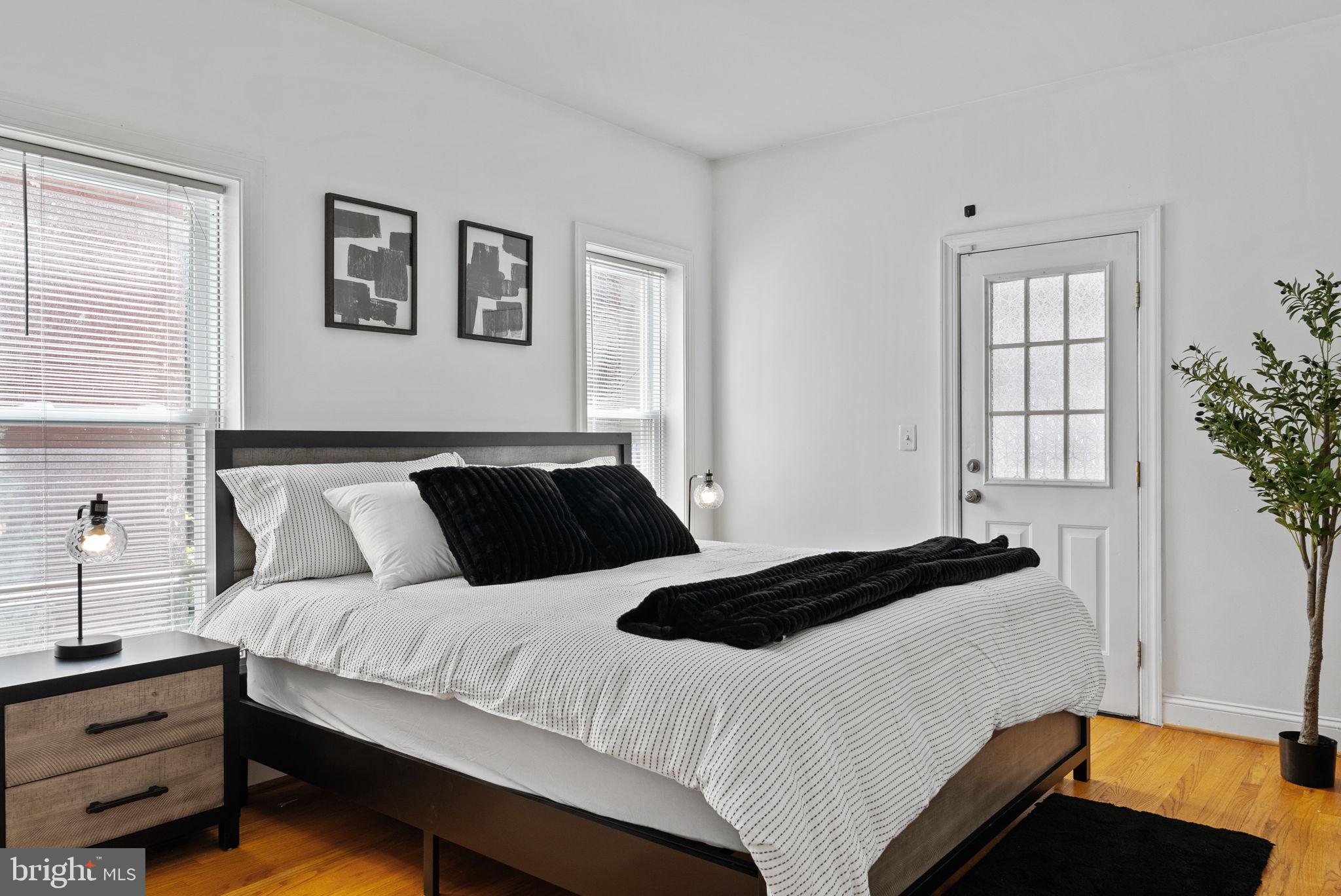 18 N Street Northwest, Unit 2 Washington, DC 20001 - Photo 17 of 24 a bedroom with bed lamp and a window