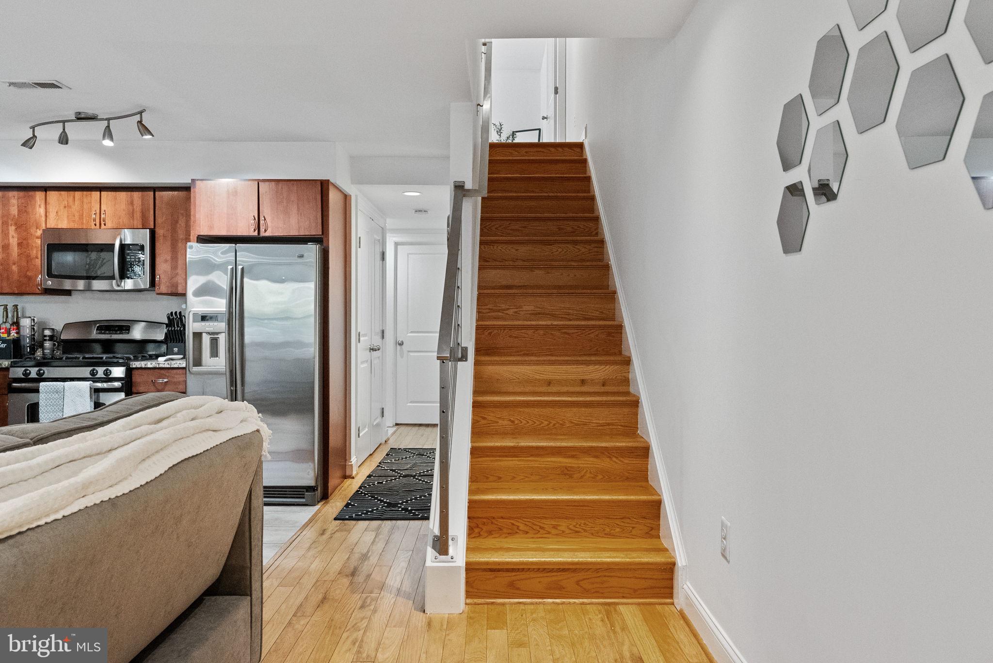 18 N Street Northwest, Unit 2 Washington, DC 20001 - Photo 19 of 24 a view of a kitchen with wooden floor and electronic appliances