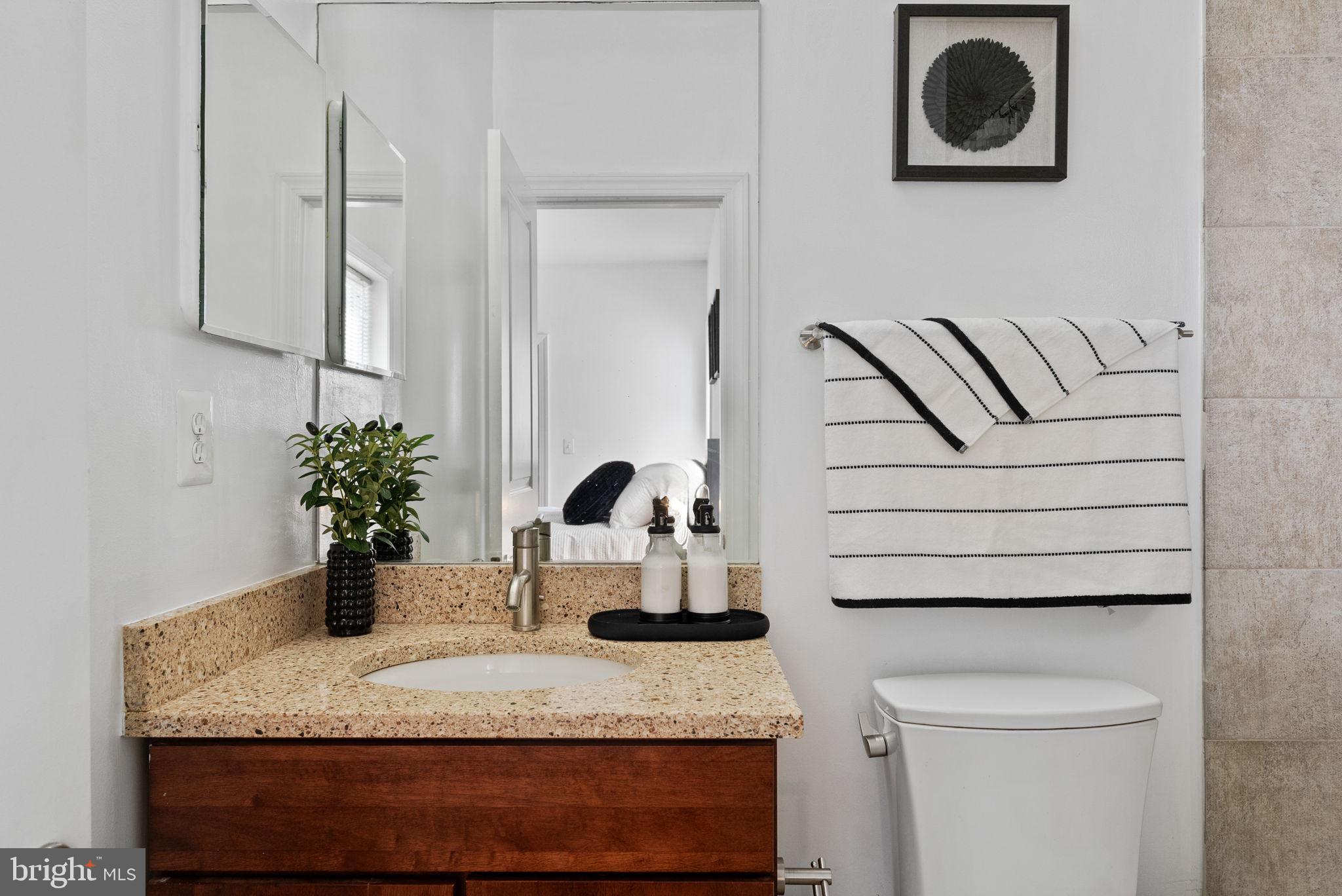 18 N Street Northwest, Unit 2 Washington, DC 20001 - Photo 21 of 24 a bathroom with a sink and a mirror