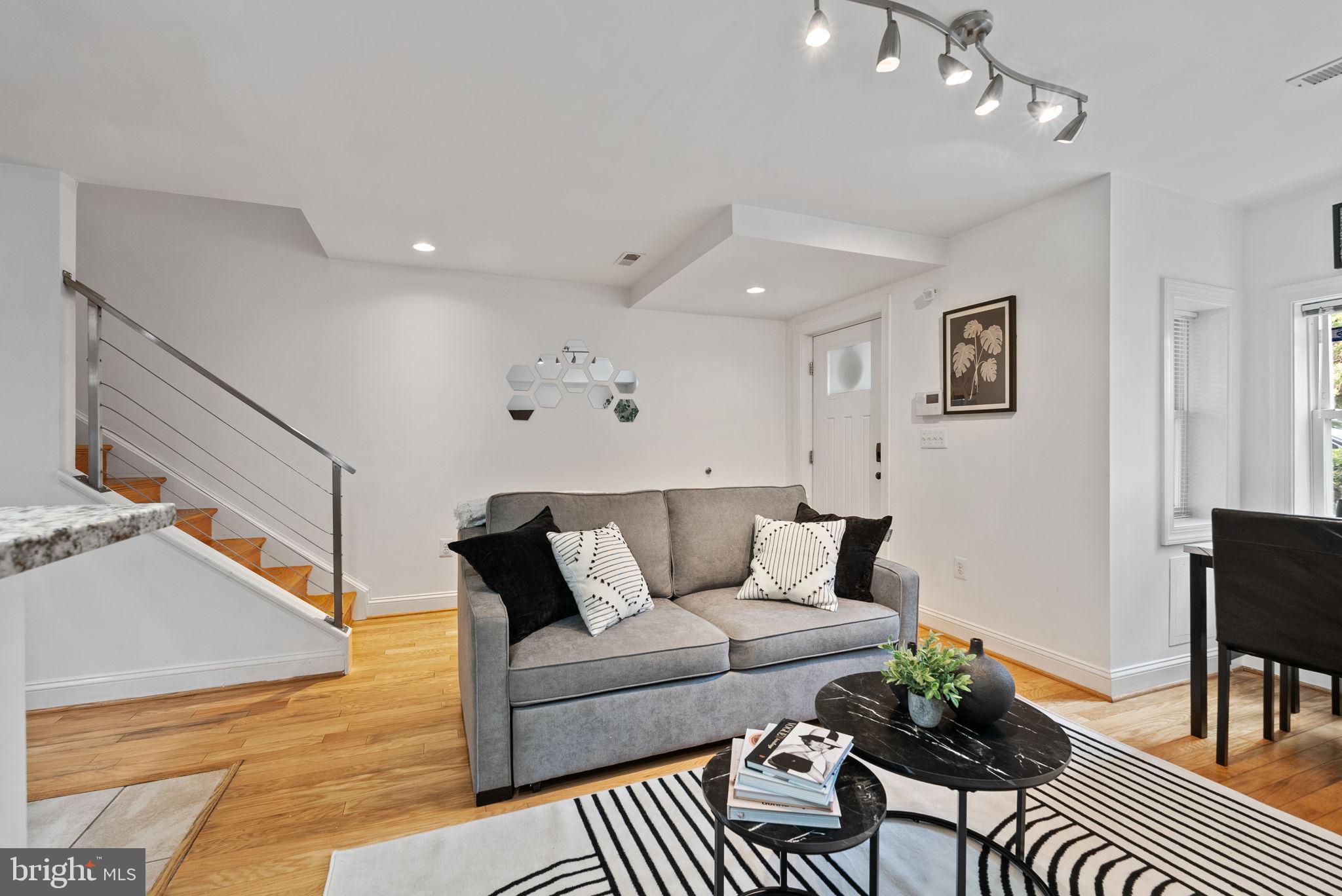 18 N Street Northwest, Unit 2 Washington, DC 20001 - Photo 5 of 24 a living room with furniture and a rug