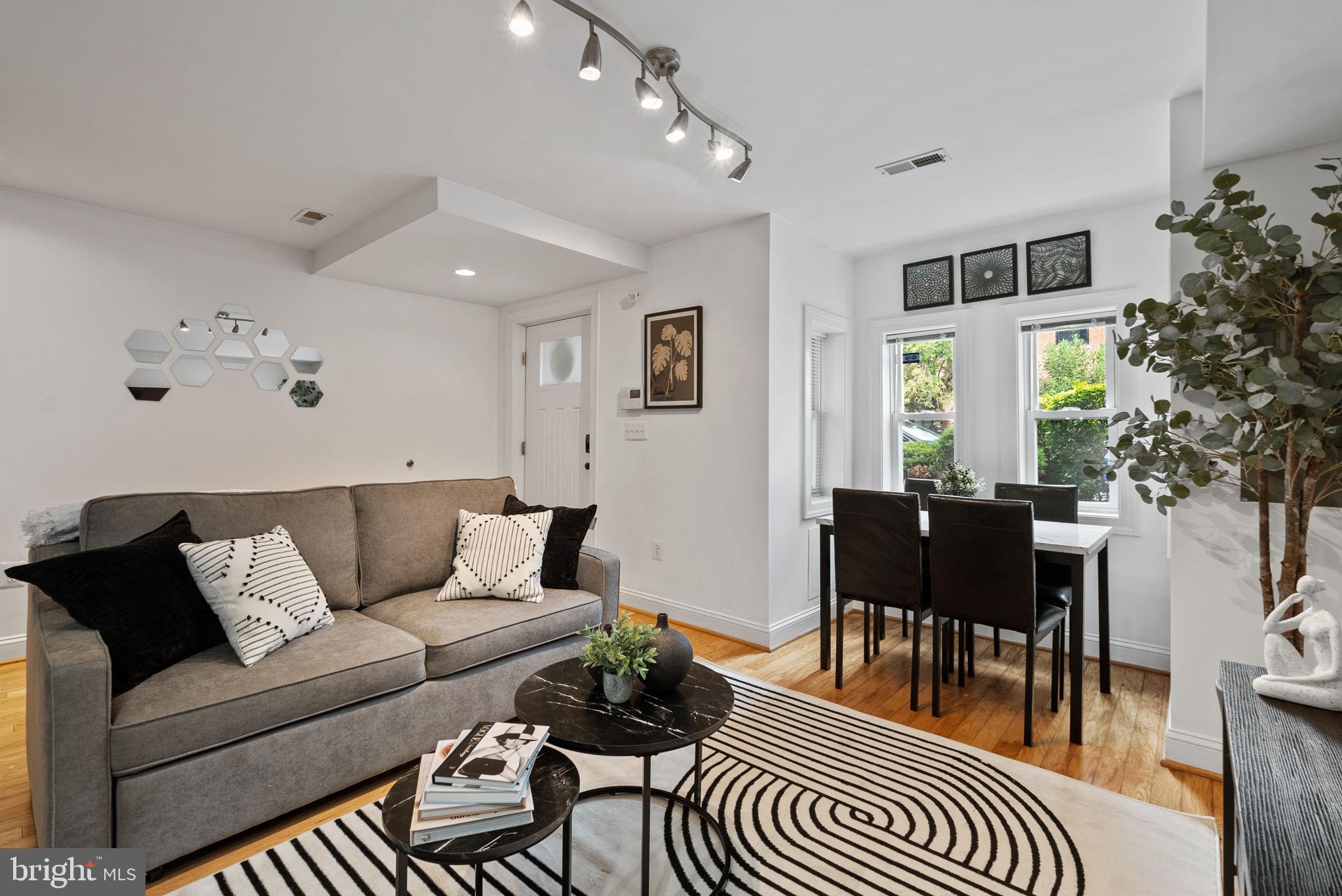 18 N Street Northwest, Unit 2 Washington, DC 20001 - Photo 6 of 24 a living room with furniture and wooden floor