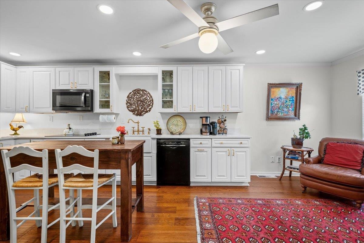 The wall between kitchen and den was removed to create a functional, beautiful space.