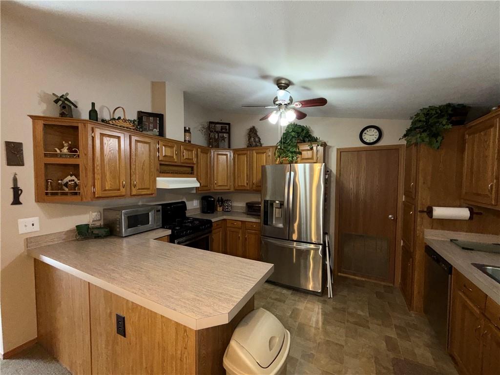 1881 Westford Road Jamestown, PA 16134 - Photo 17 of 50 a kitchen with stainless steel appliances granite countertop a sink refrigerator and microwave