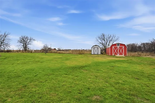 a view of a swimming pool with a yard