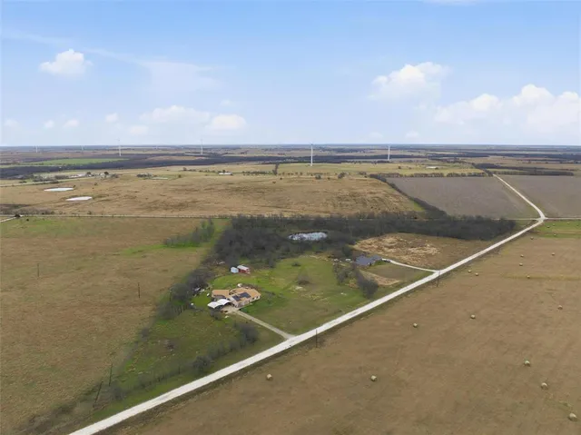 a view of a swimming pool and an outdoor seating