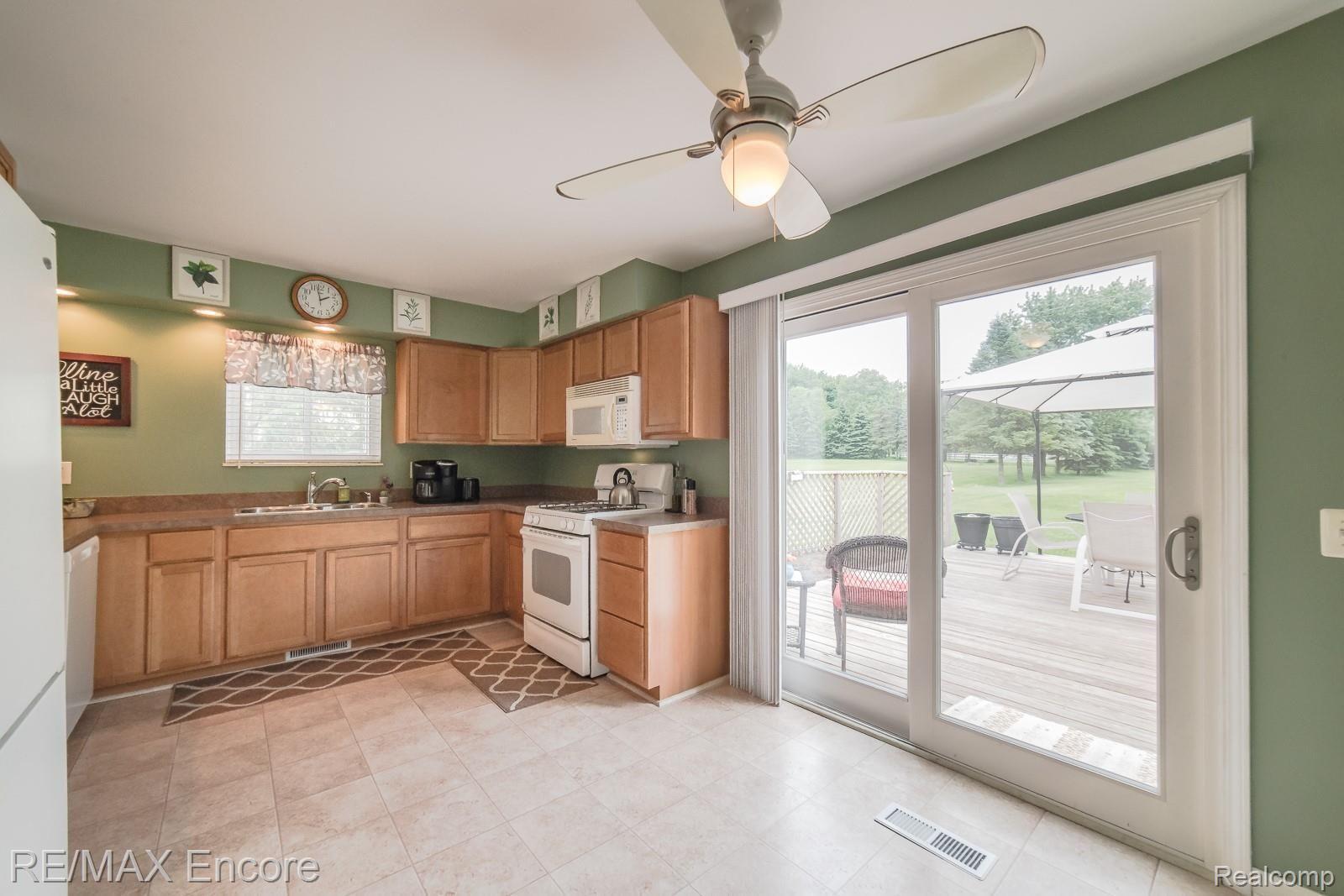 9310 Allen Road Clarkston, MI 48348 - Photo 8 of 45 Generous kitchen with doorwall to deck