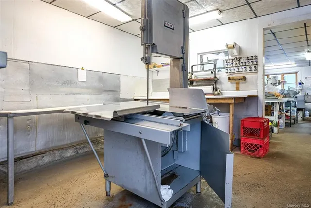 a view of a storage & utility room with a sink