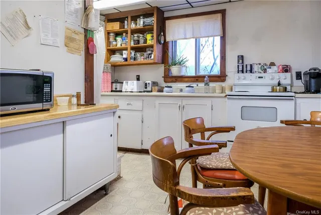 a bathroom with a sink a toilet and bathtub
