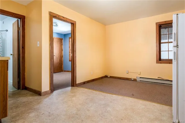 a bathroom with a granite countertop sink a toilet and a shower