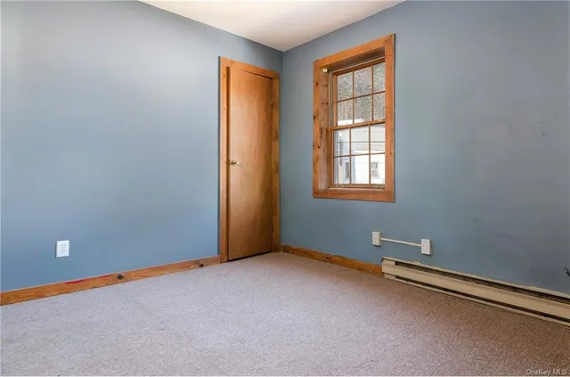 a view of a hallway with staircase