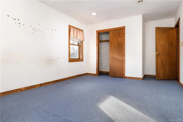 a kitchen with a stove top oven and refrigerator