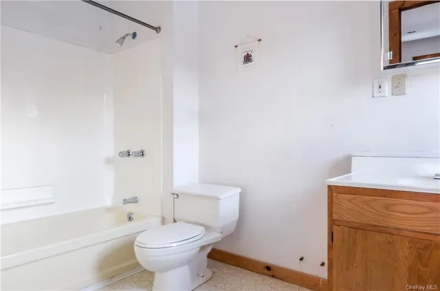 a front view of a house with parking