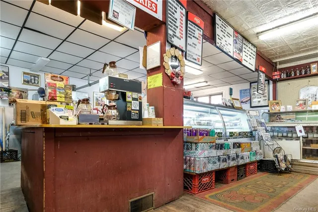 a view of a refrigerator with sitting area
