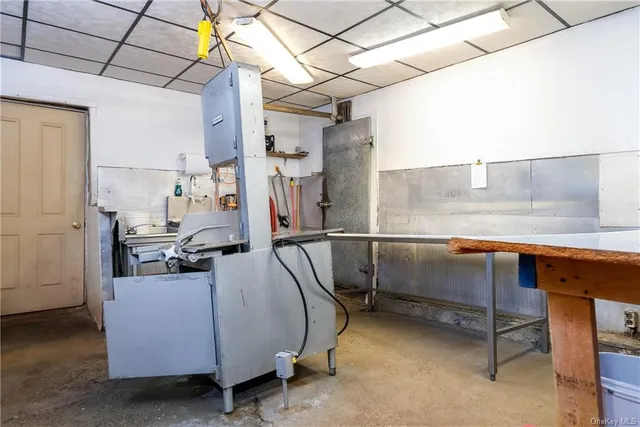a open kitchen with a sink stove and a refrigerator