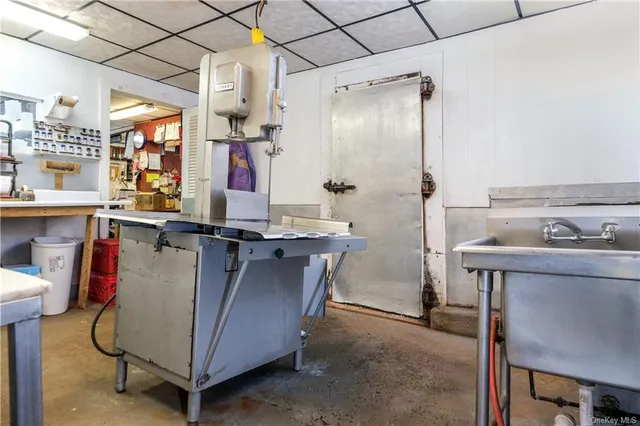 a kitchen with a sink a stove and a refrigerator
