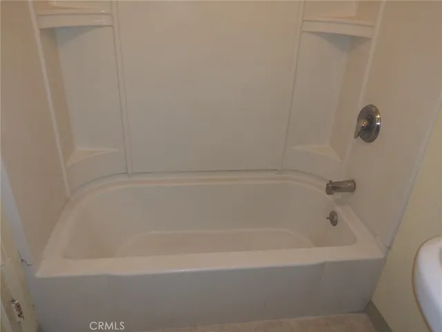 a close view of a bathtub in bathroom