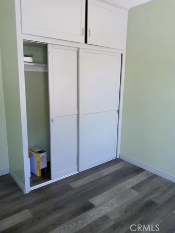 a view of a small space with wooden floor