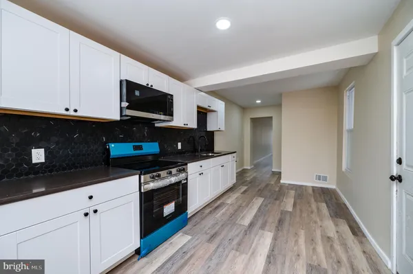 a large kitchen with cabinets