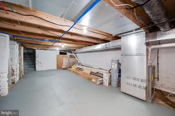 a view of empty room with wooden ceiling