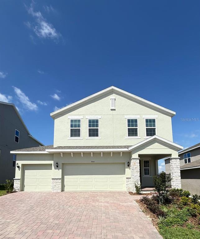 7501 Catania Loop Clermont, FL 34714 - Photo 2 of 12 a view of a house with a outdoor space and porch