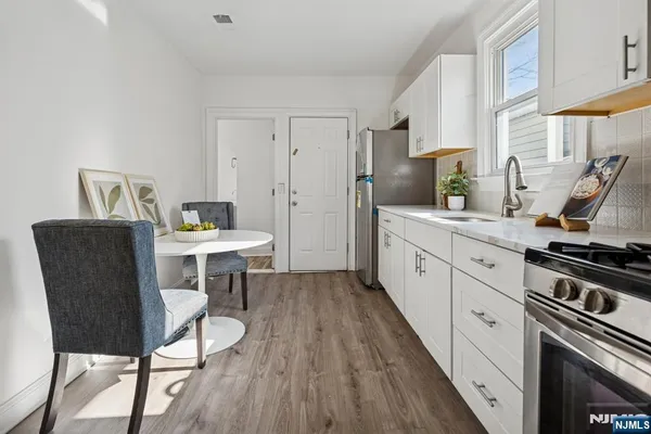 a view of kitchen with breakfast area