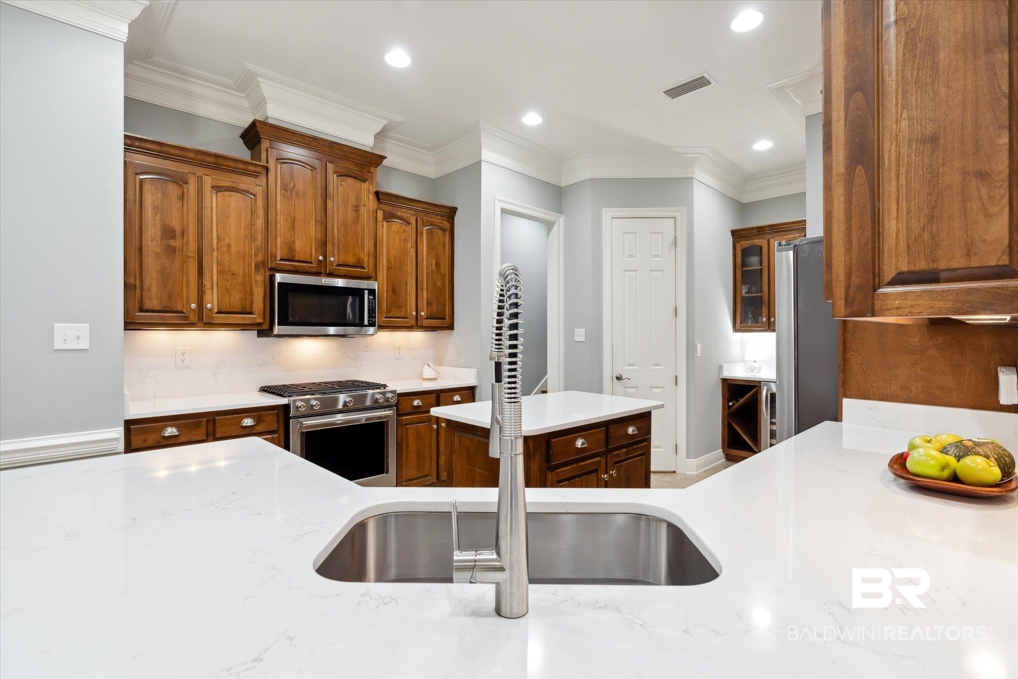 804 Country Club Road Mobile, AL 36609 - Photo 42 of 63 Kitchen featuring ornamental molding, light stone countertops, backsplash, and stainless steel appliances