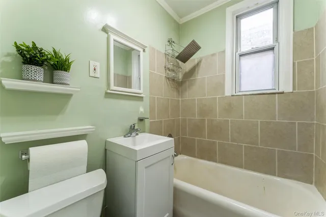 a bathroom with a toilet sink and bathtub