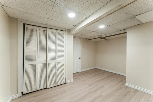 an empty room with wooden floor