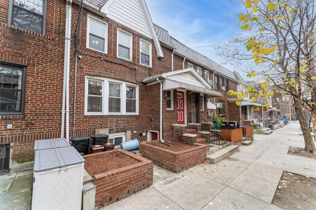 a front view of a building with sitting area