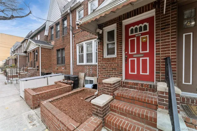 a view of a brick building with many windows