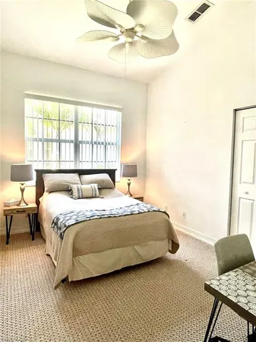a view of a room with a table and chairs