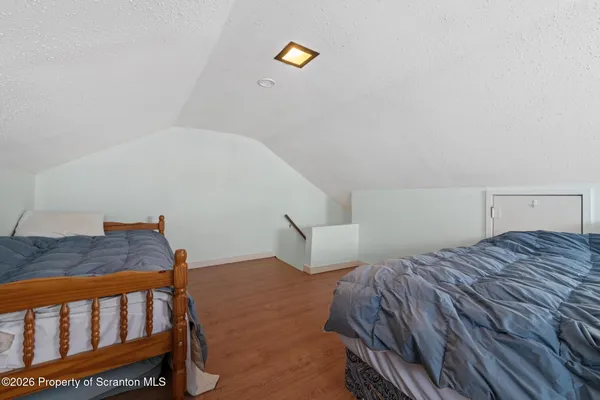 a bedroom with a bed and cabinets