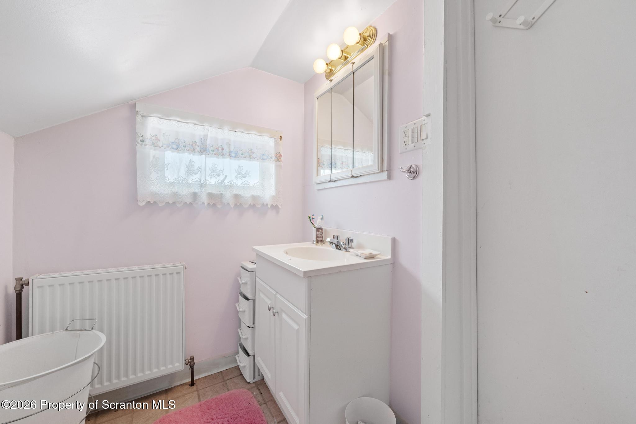 812 Old Street Hazleton, PA 18202 - Photo 18 of 29 a bathroom with a sink toilet and window