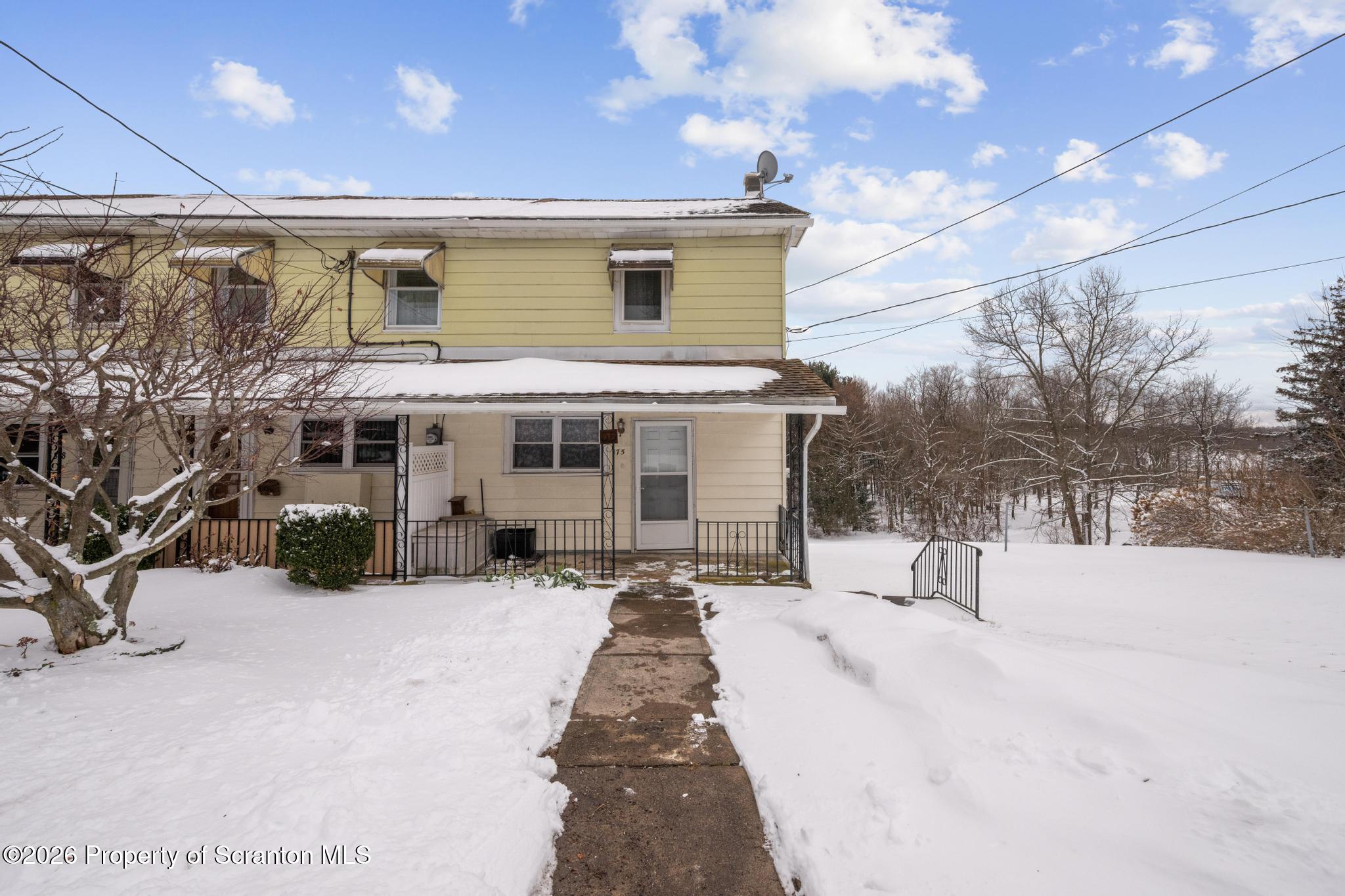 812 Old Street Hazleton, PA 18202 - Photo 2 of 29 a view of a house with a snow in the yard